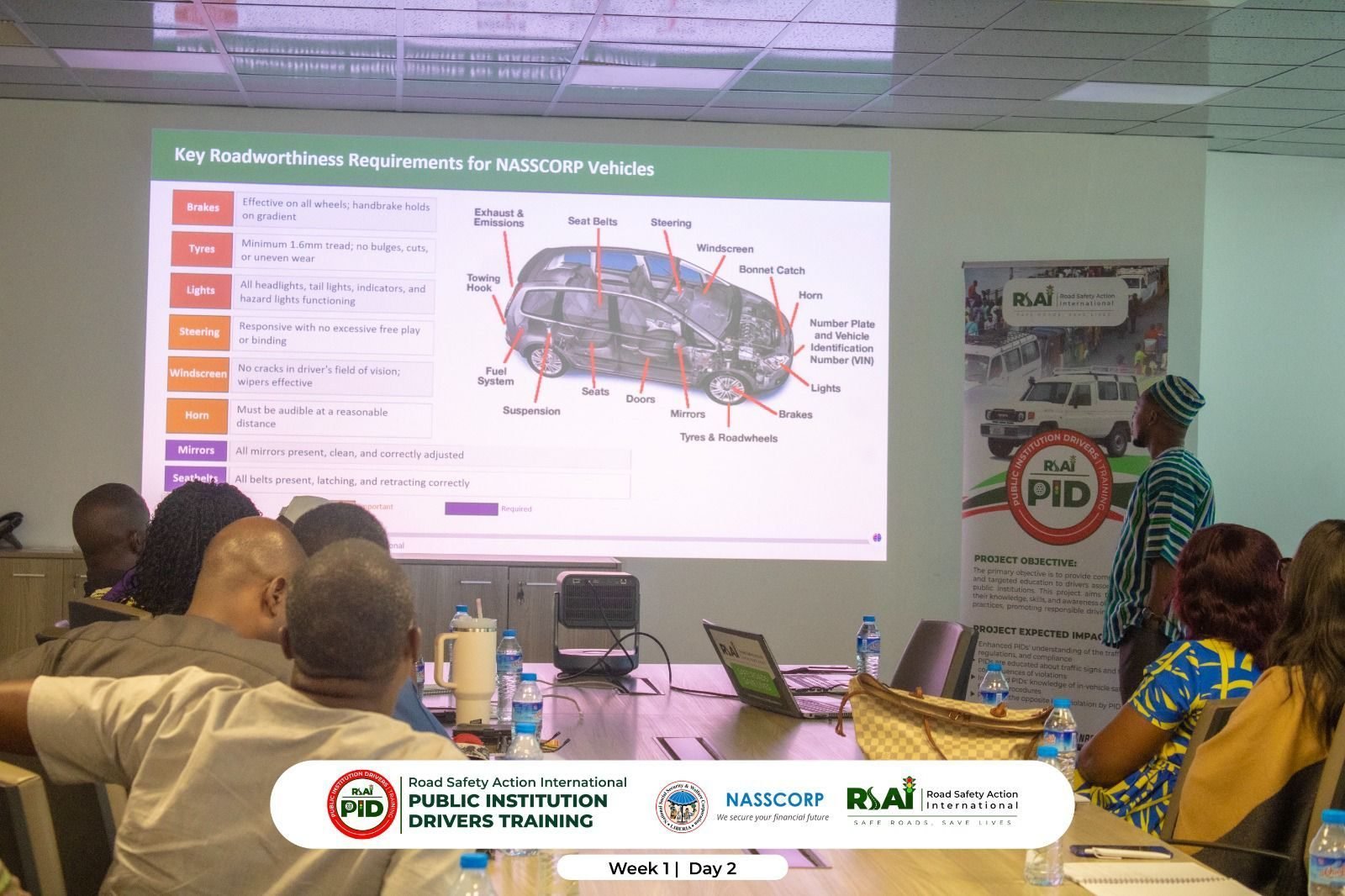 A facilitator presents a slide on roadworthiness requirements for NASSCORP vehicles