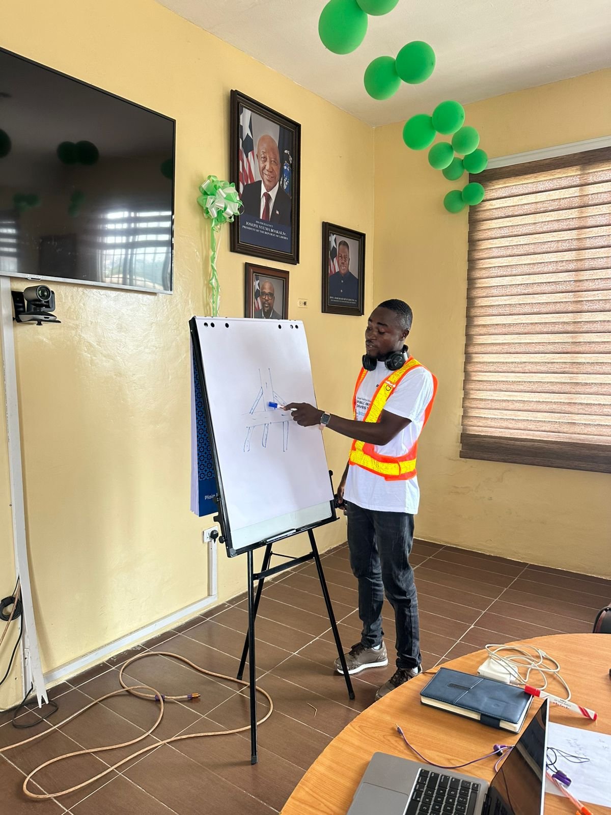 A facilitator works through an exercise on the flip chart